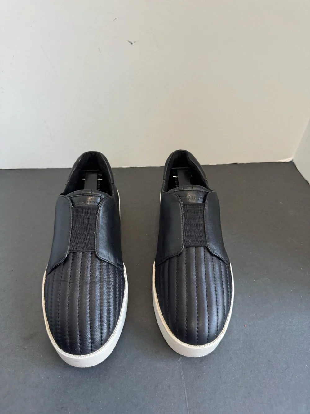 Donna Karan New York black leather slip-on sneakers. Size 6